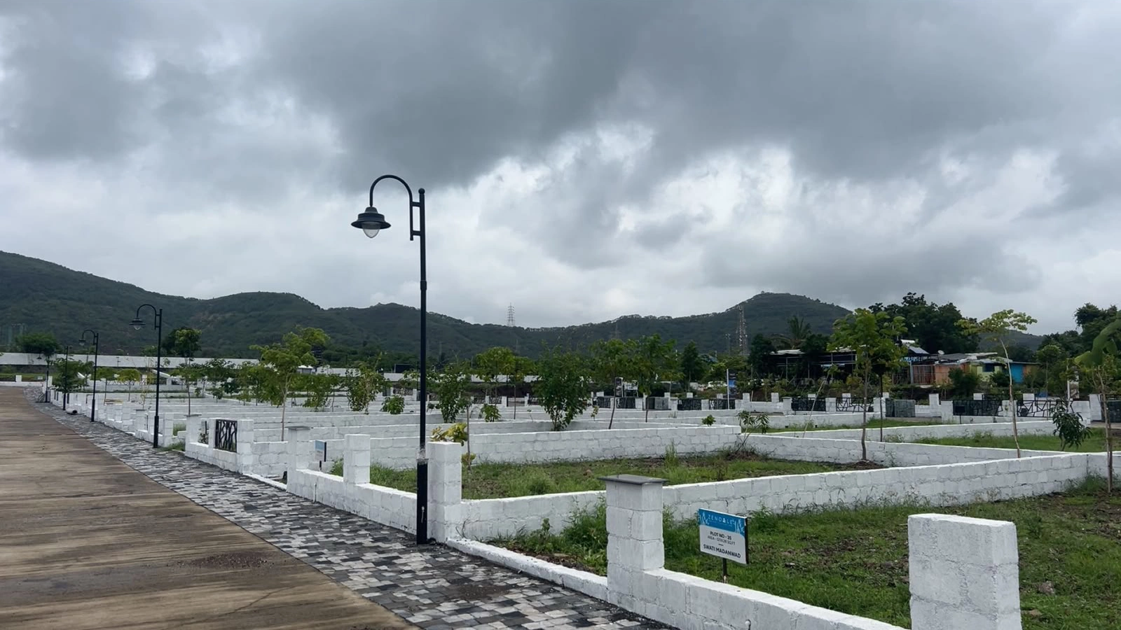 Vogue Estate — developed plots with hill backdrop