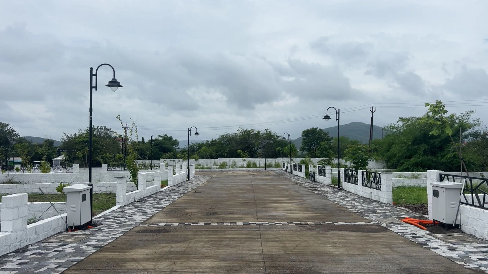 Vogue Estate — entrance road with boundary walls