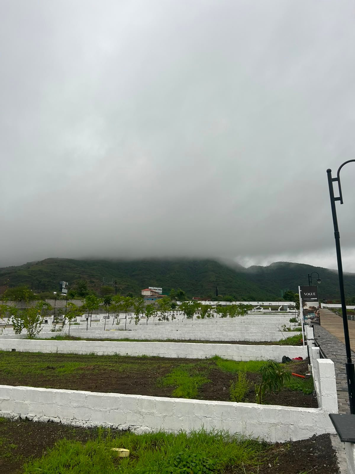 Vogue Estate — plotted development with monsoon hills